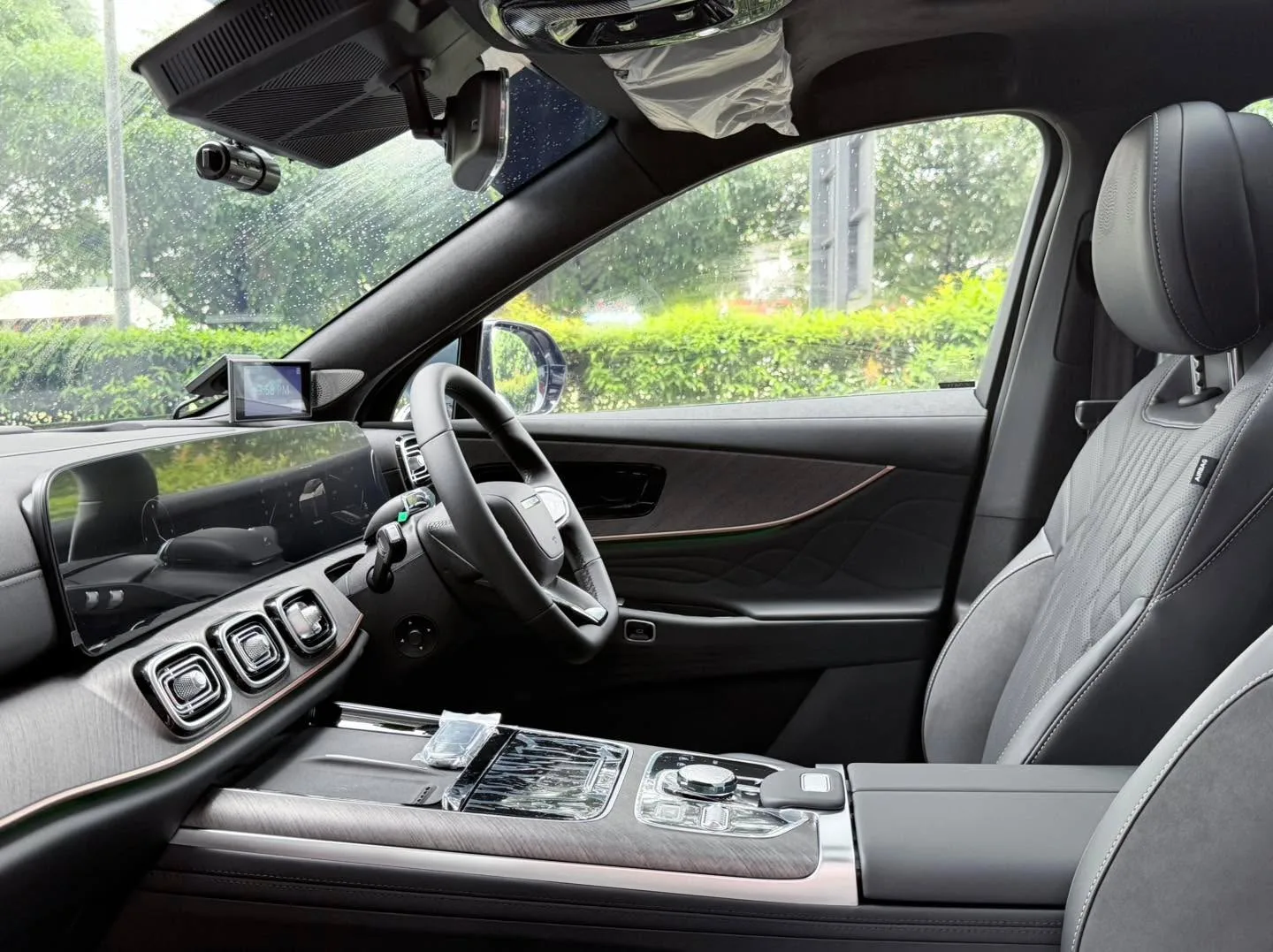 Interior of the J8 showing the steering wheel, dashboard and front windows with tint applied.