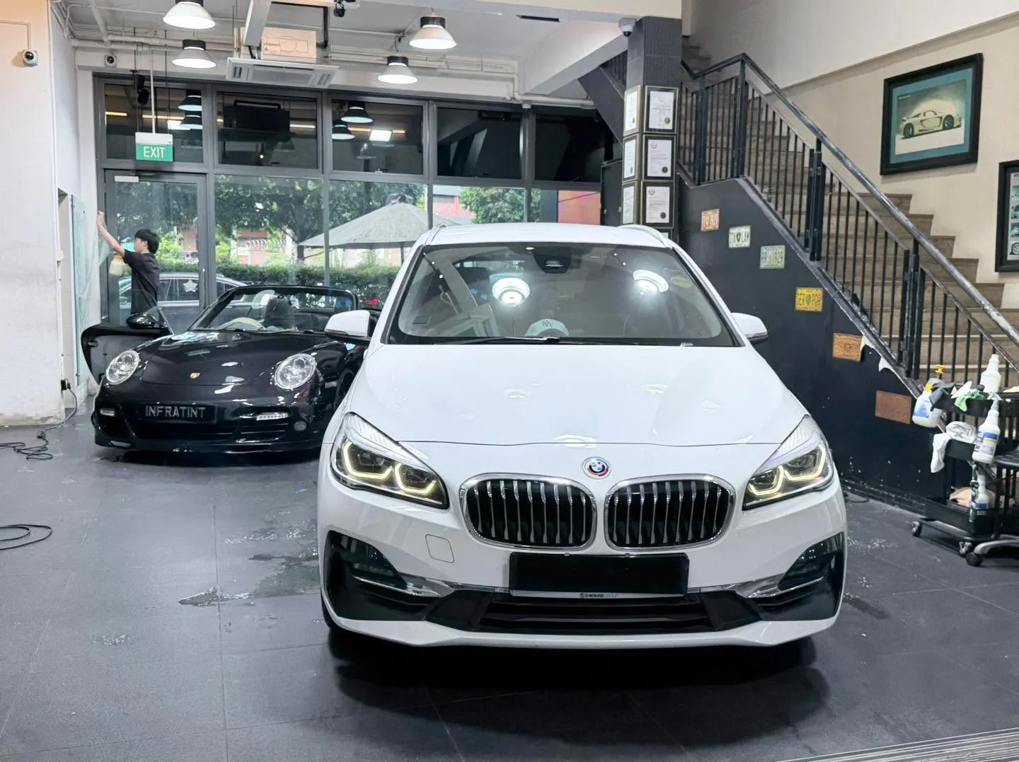 A grey Mercedes-Benz saloon viewed from the front.