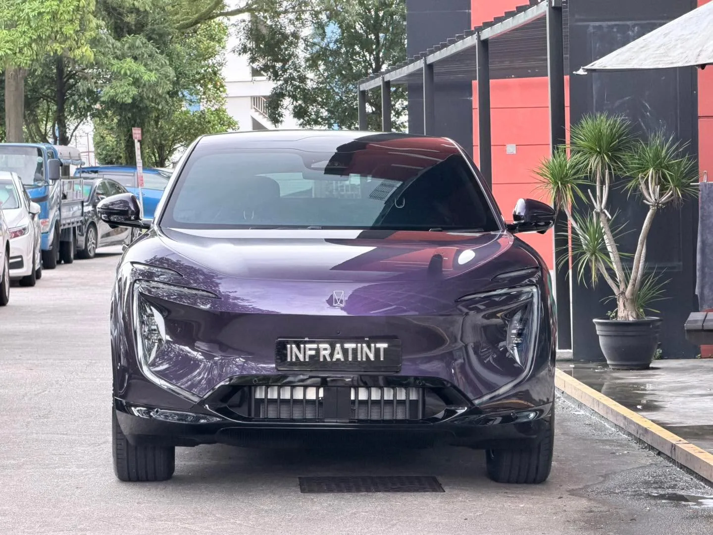 A purple Avatr 07 electric SUV parked at Infratint, viewed from the front.