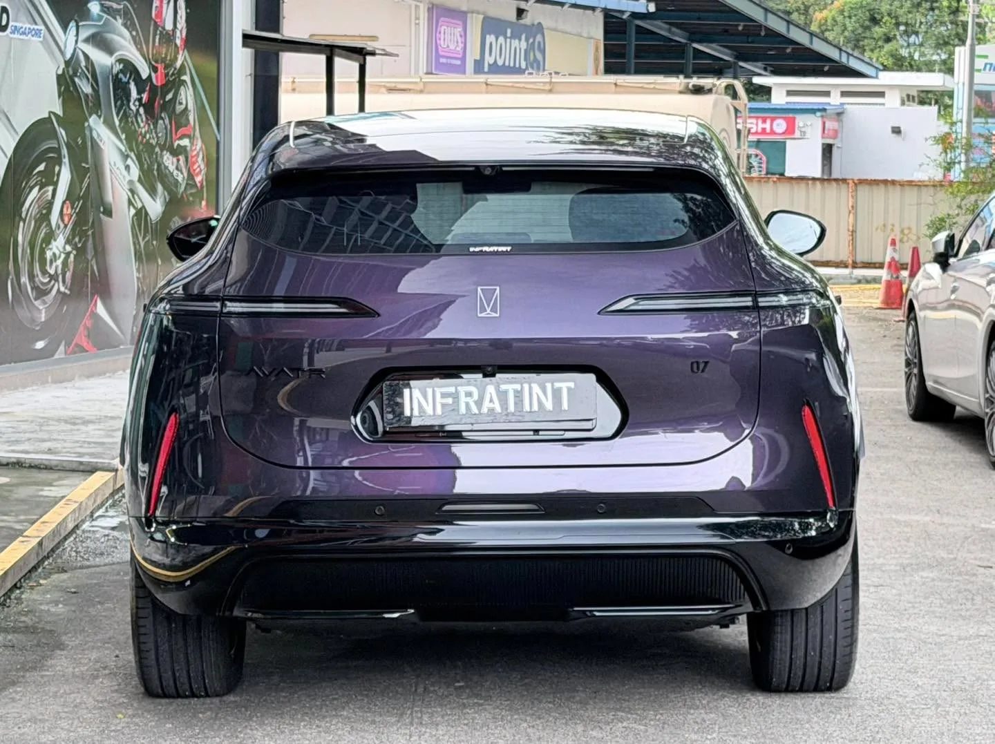 The rear of the purple Avatr 07, showing the distinctive tail lights and badging.