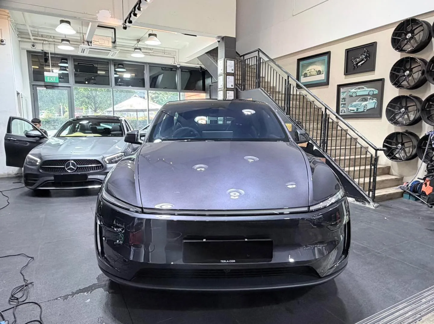 A silver Subaru Impreza compact saloon parked indoors.