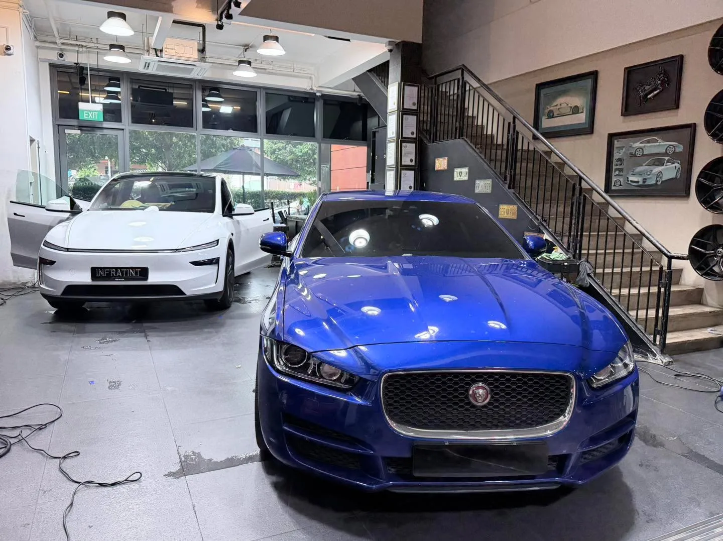 A white BMW X3, white Mercedes-Benz A200, and white MG S6 parked in a row.