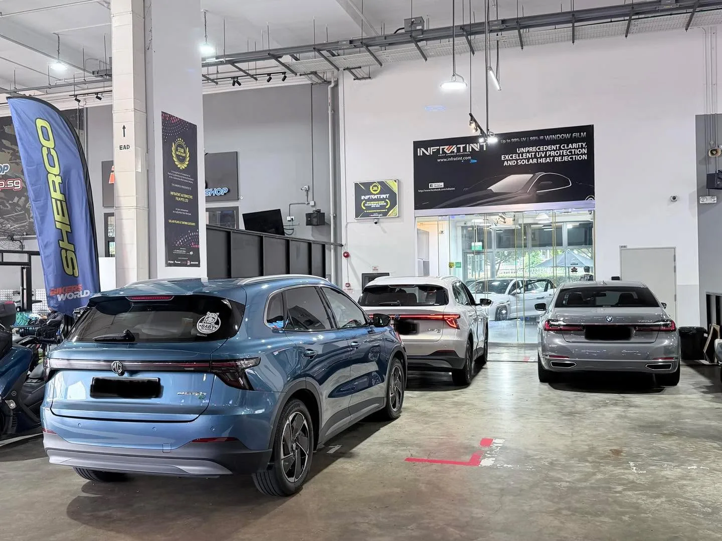 A blue MG S5 SUV parked in the workshop bay.