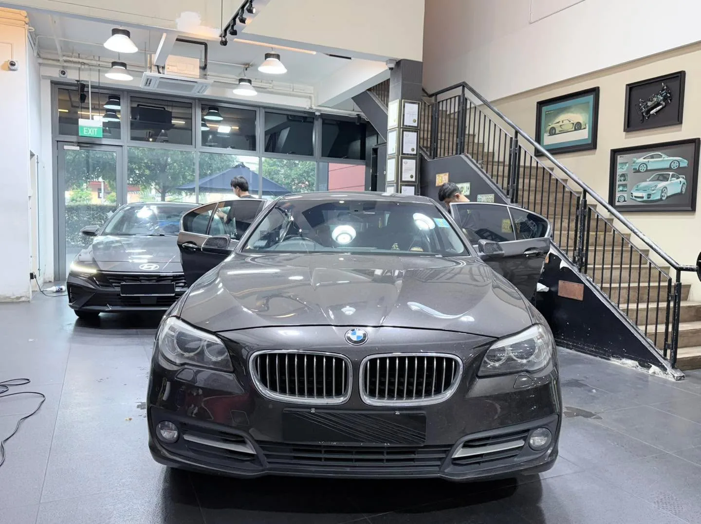 A black BMW saloon viewed from the front.