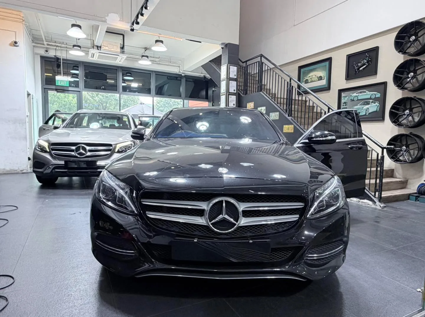 A white Mercedes-Benz GLC 300 facing the camera with a Hyundai Avante and another vehicle behind.
