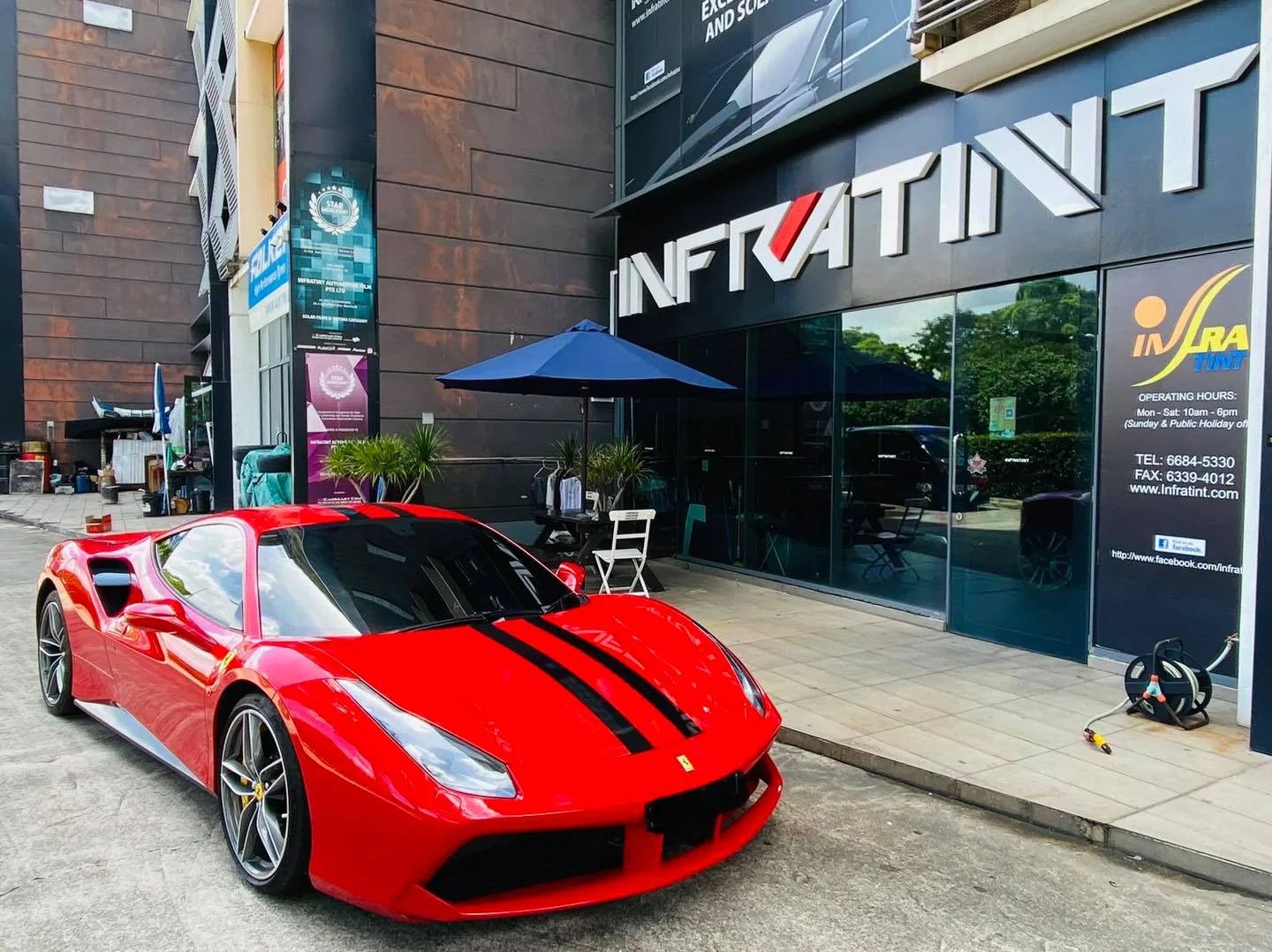 Red Ferrari 488 GTB parked outside Infratint Singapore before window tinting