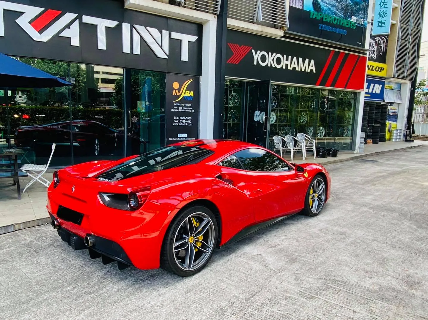 Red Ferrari 488 GTB rear three-quarter view at Infratint Singapore