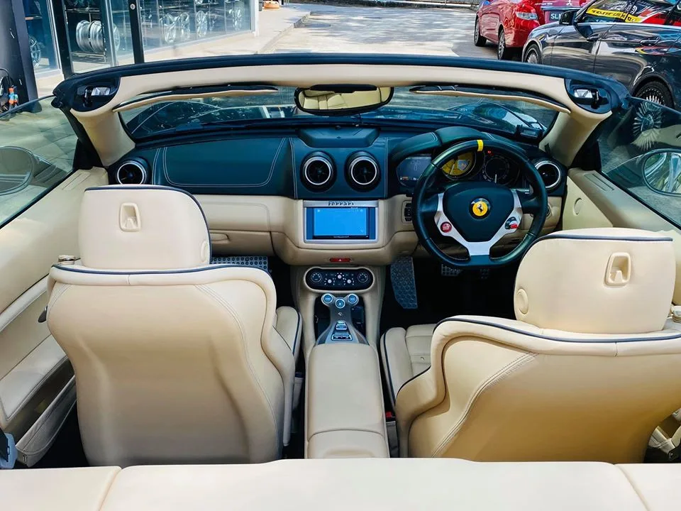 Tan interior and steering wheel of a Ferrari California convertible at Infratint Singapore
