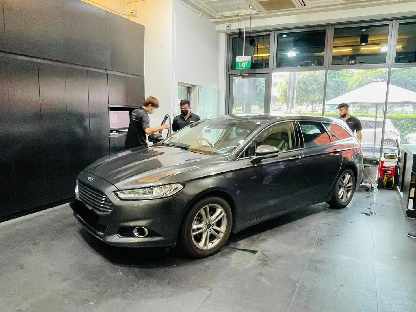 Side profile of a grey Ford Mondeo during window tinting at Infratint Singapore