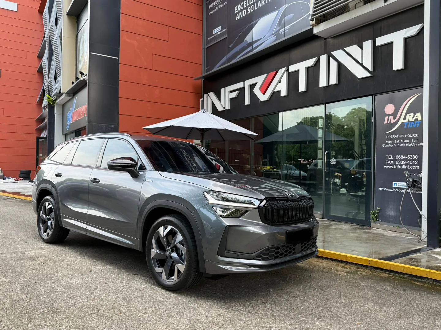 Grey Skoda Kodiaq front three-quarter view outside Infratint Singapore