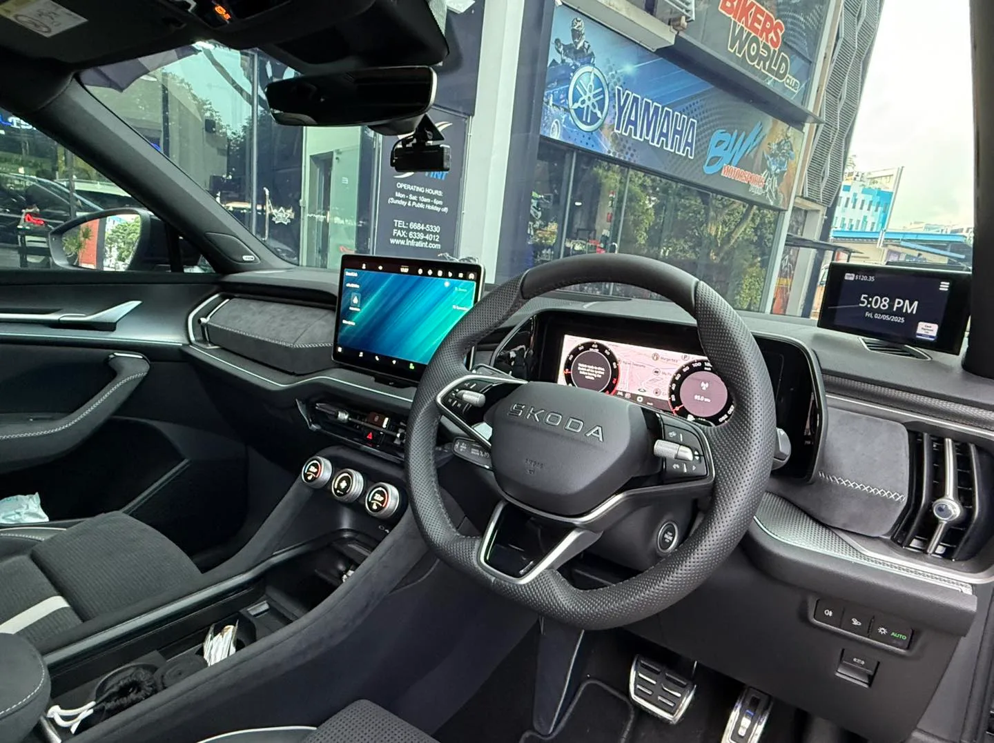 Skoda Kodiaq interior dashboard and steering wheel seen through tinted glass at Infratint Singapore
