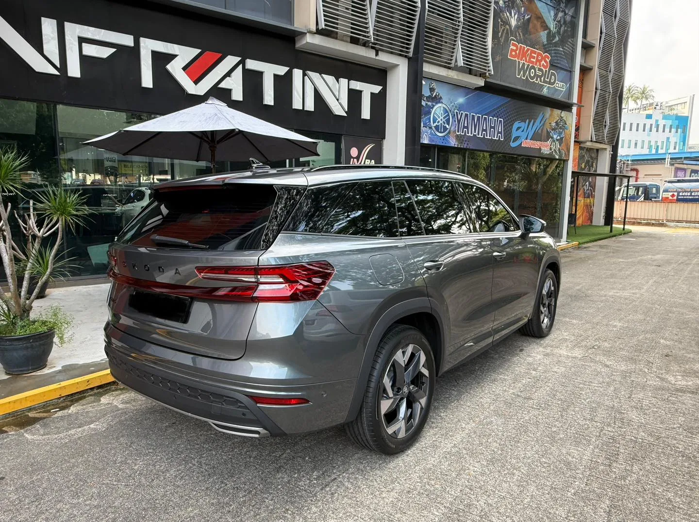 Grey Skoda Kodiaq rear three-quarter view outside Infratint Singapore