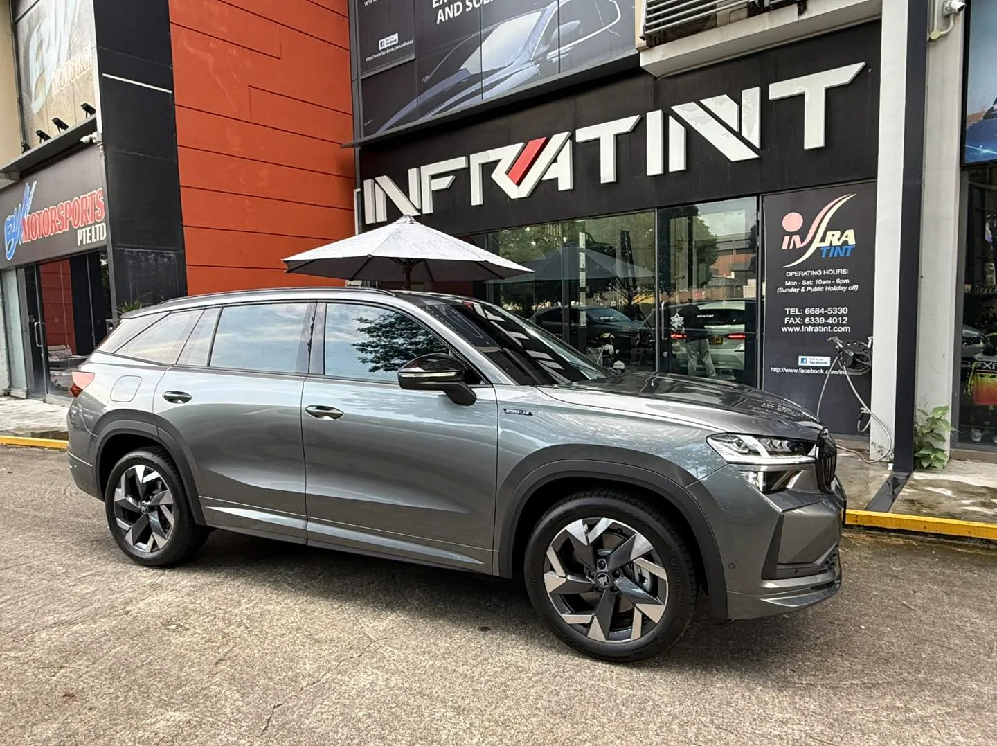 Grey Skoda Kodiaq side profile with tinted windows at Infratint Singapore