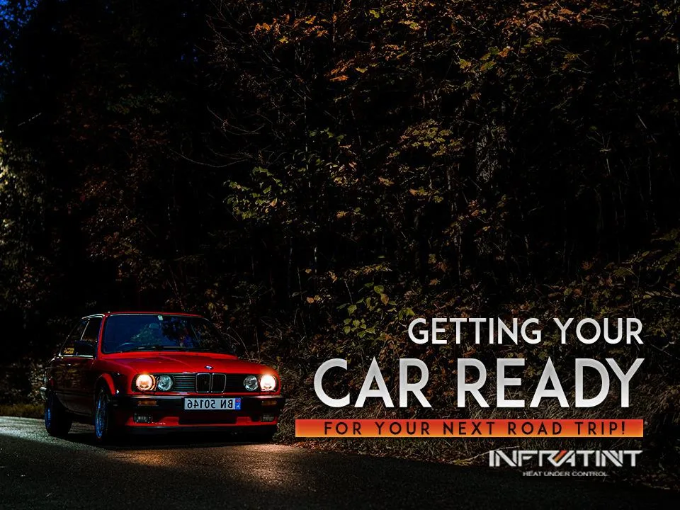 Infratint road trip guide banner showing a red car with headlights on a forest road at night