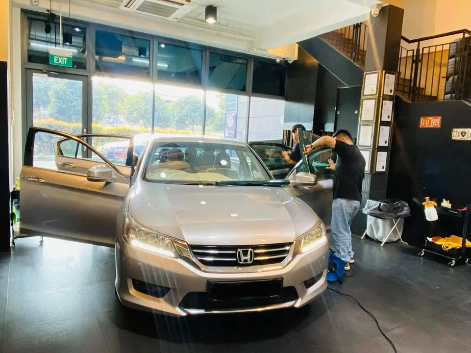 Silver Honda Accord sedan having its front window tinted at Infratint Singapore