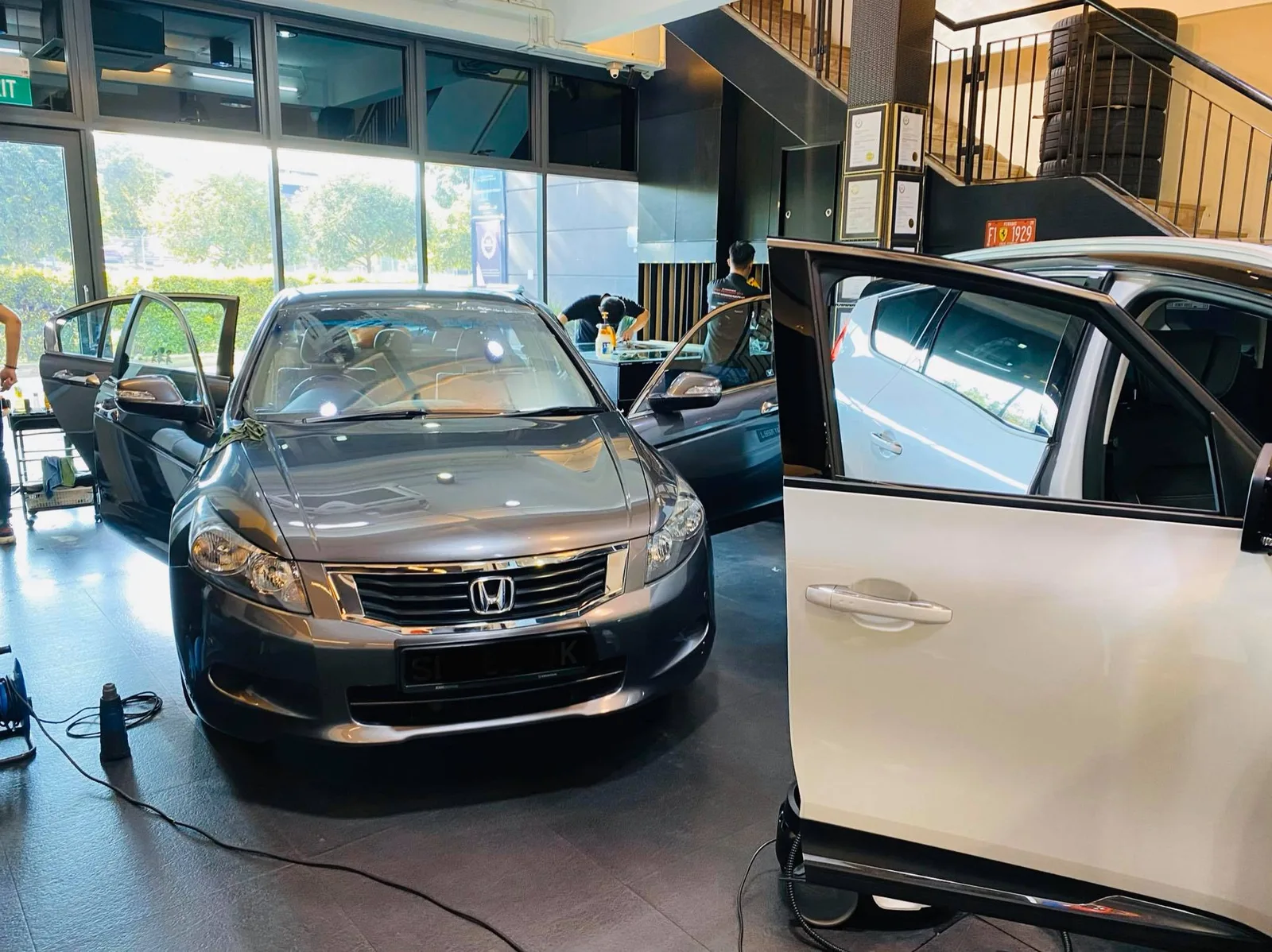 Grey Honda Accord sedan being prepped for window tinting at Infratint Singapore