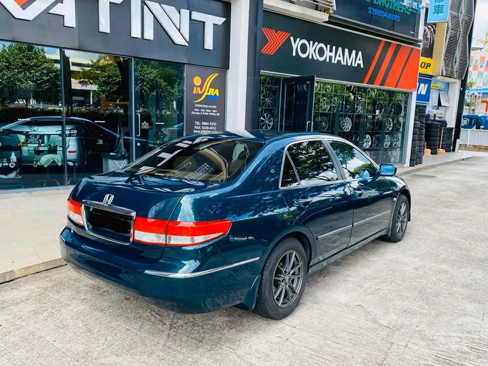 Tinted dark green Honda Accord rear three-quarter view outside Infratint Singapore