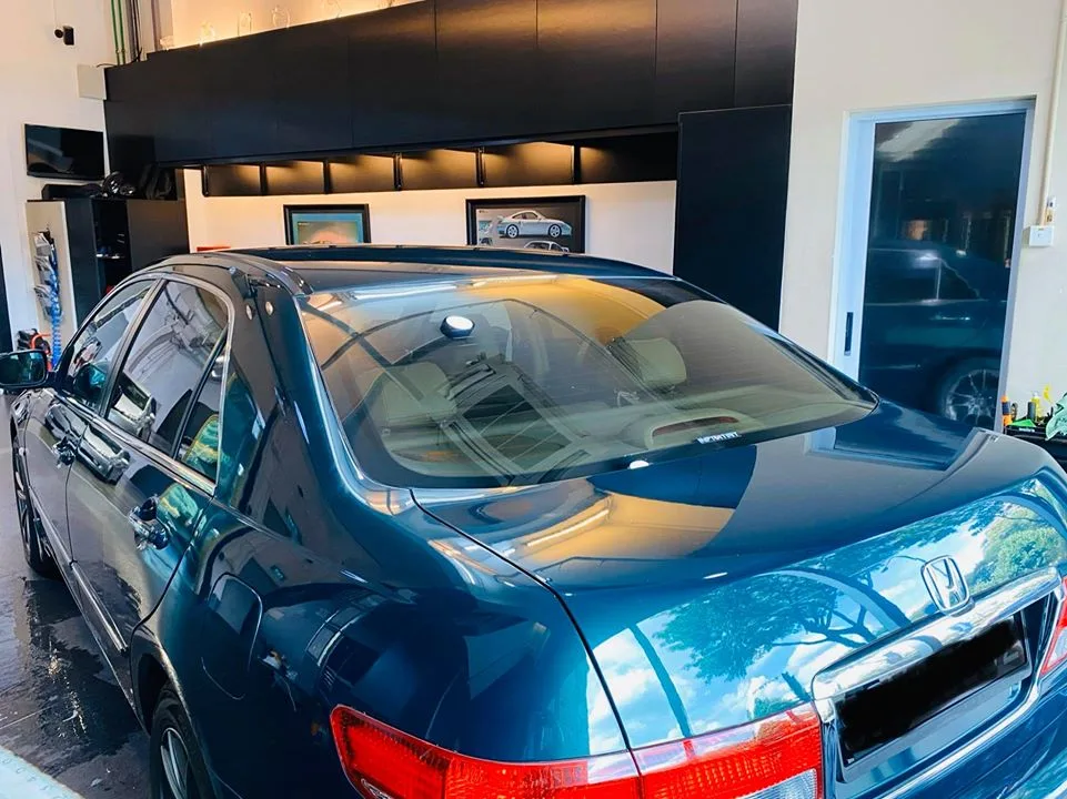 Tinted dark green Honda Accord rear three-quarter view at Infratint Singapore