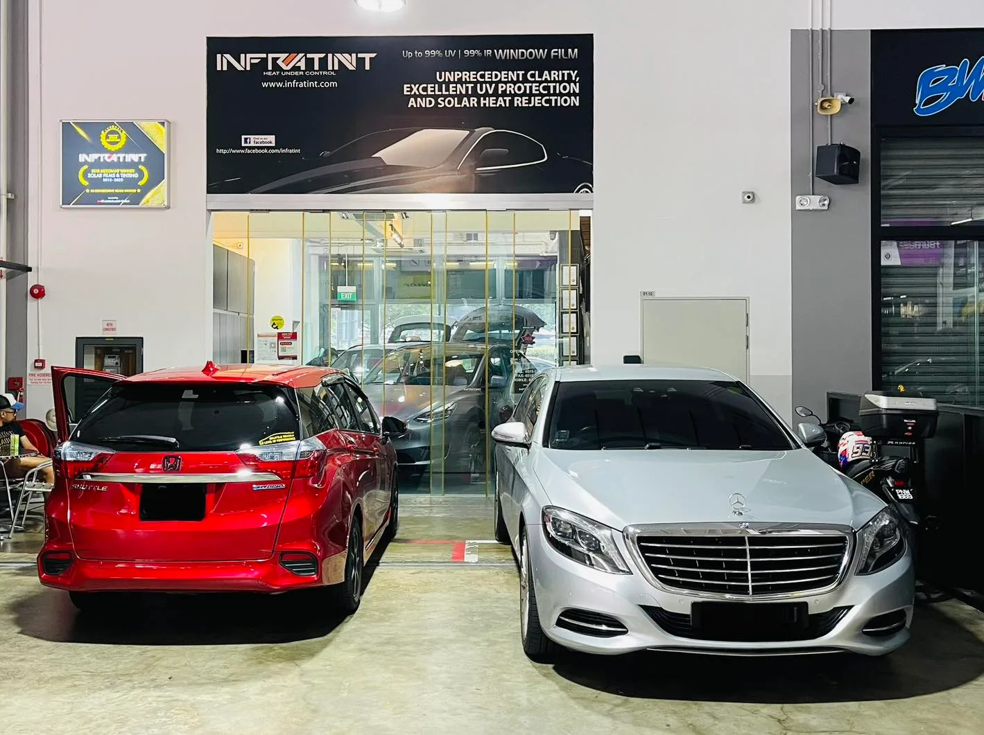 Red wagon and silver Mercedes-Benz S-Class at Infratint Singapore for window tinting
