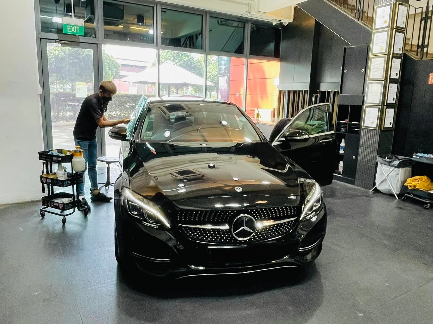 Black Mercedes-Benz C-Class during window film install at Infratint Singapore