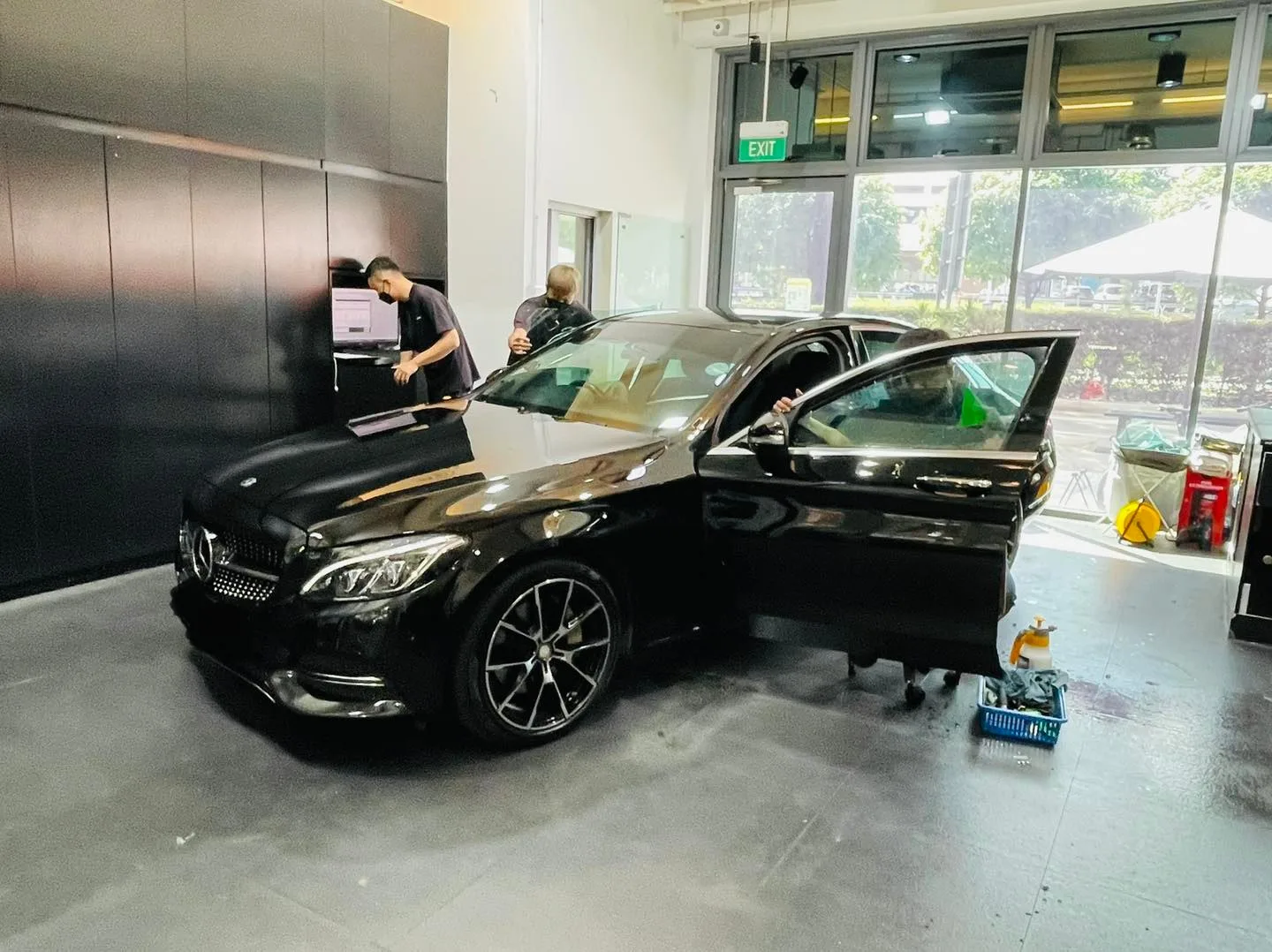Black Mercedes-Benz C-Class side view during window tinting at Infratint Singapore