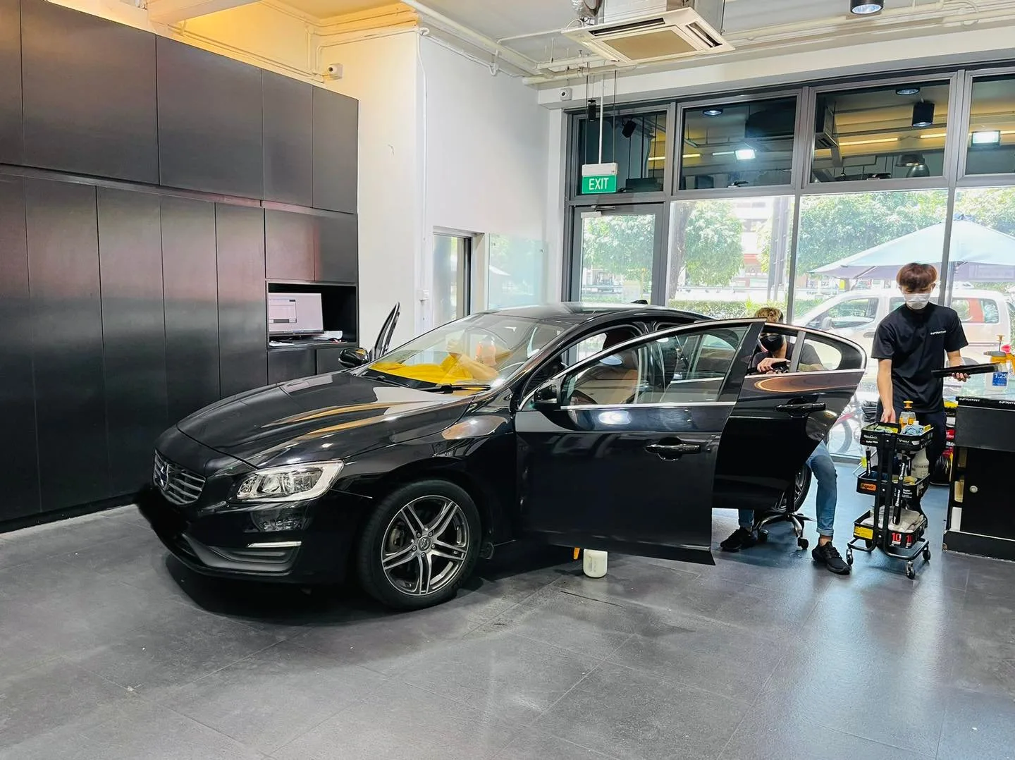 Black Volvo S60 front three-quarter during window tinting at Infratint Singapore