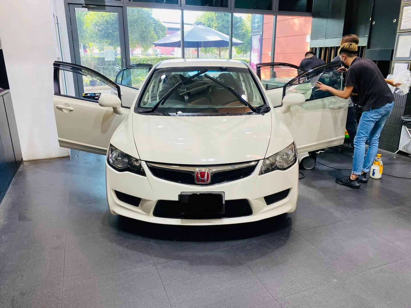 White Honda Civic sedan having window film fitted at Infratint Singapore