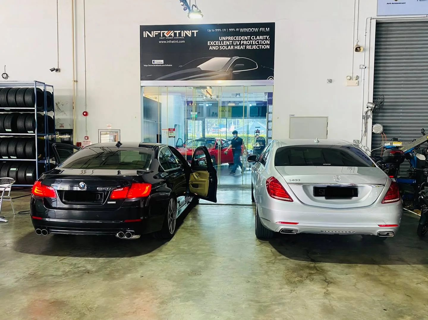 Black BMW 5 Series and silver Mercedes-Benz S-Class at Infratint Singapore for window tinting
