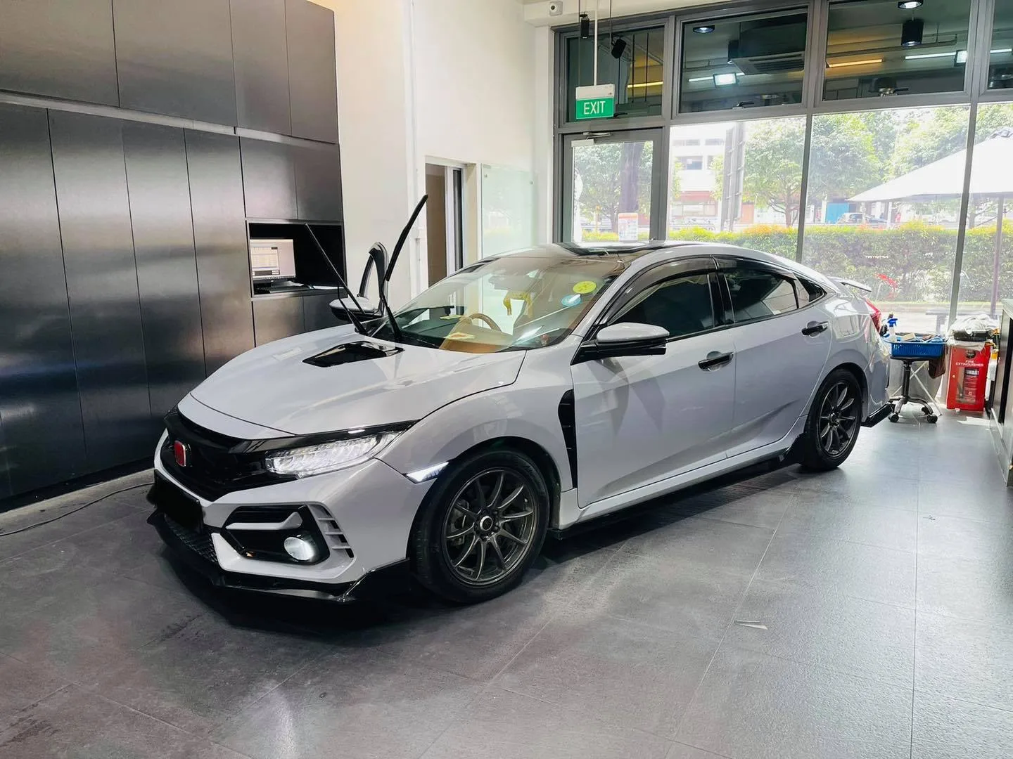 Silver Honda Civic Type R in the install bay at Infratint Singapore