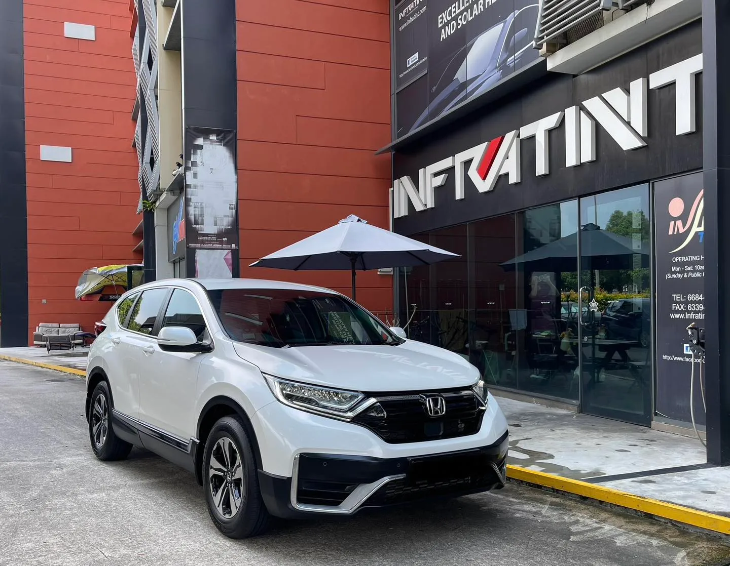 White Honda CR-V front three-quarter view outside Infratint Singapore