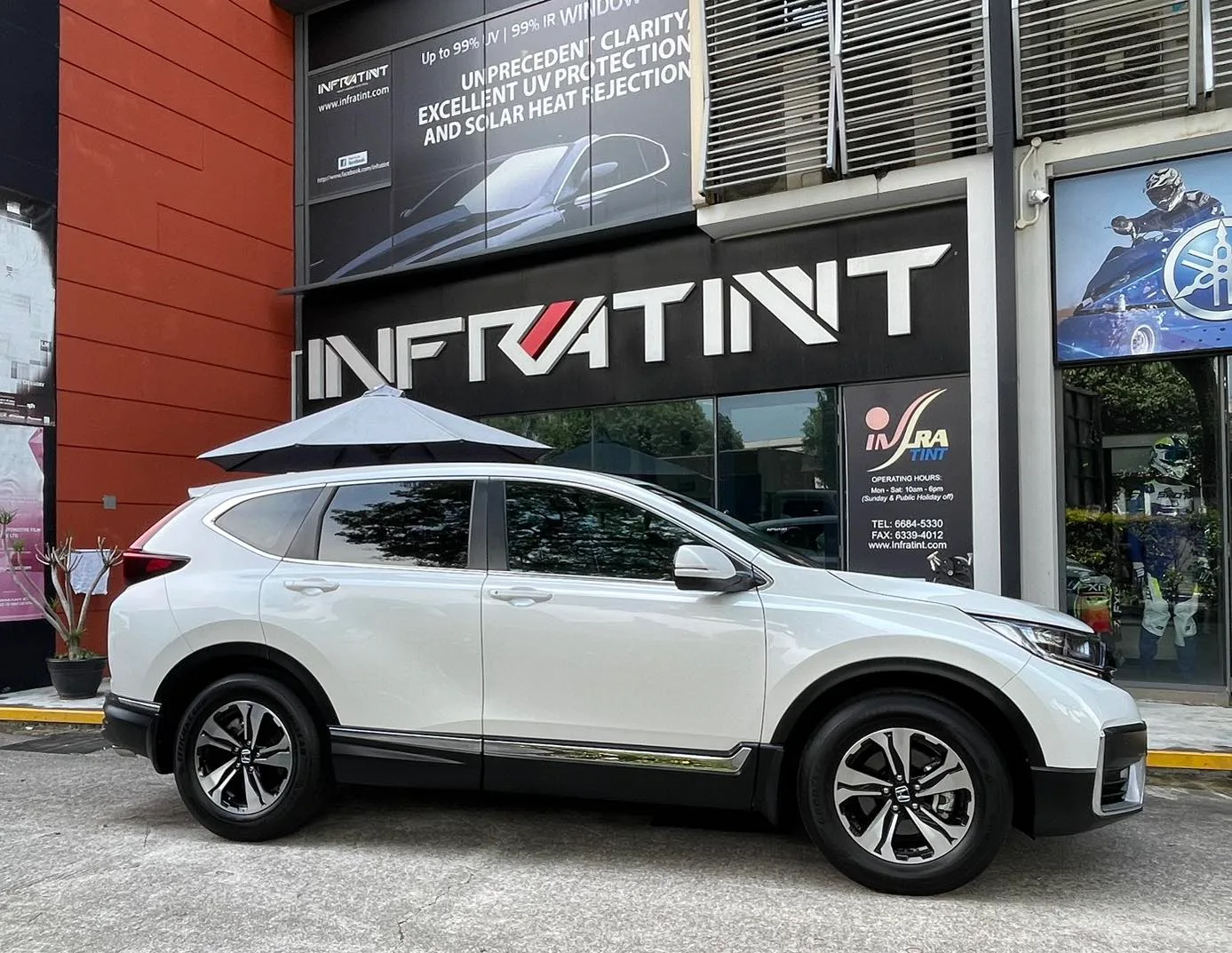 White Honda CR-V side profile with tinted windows at Infratint Singapore