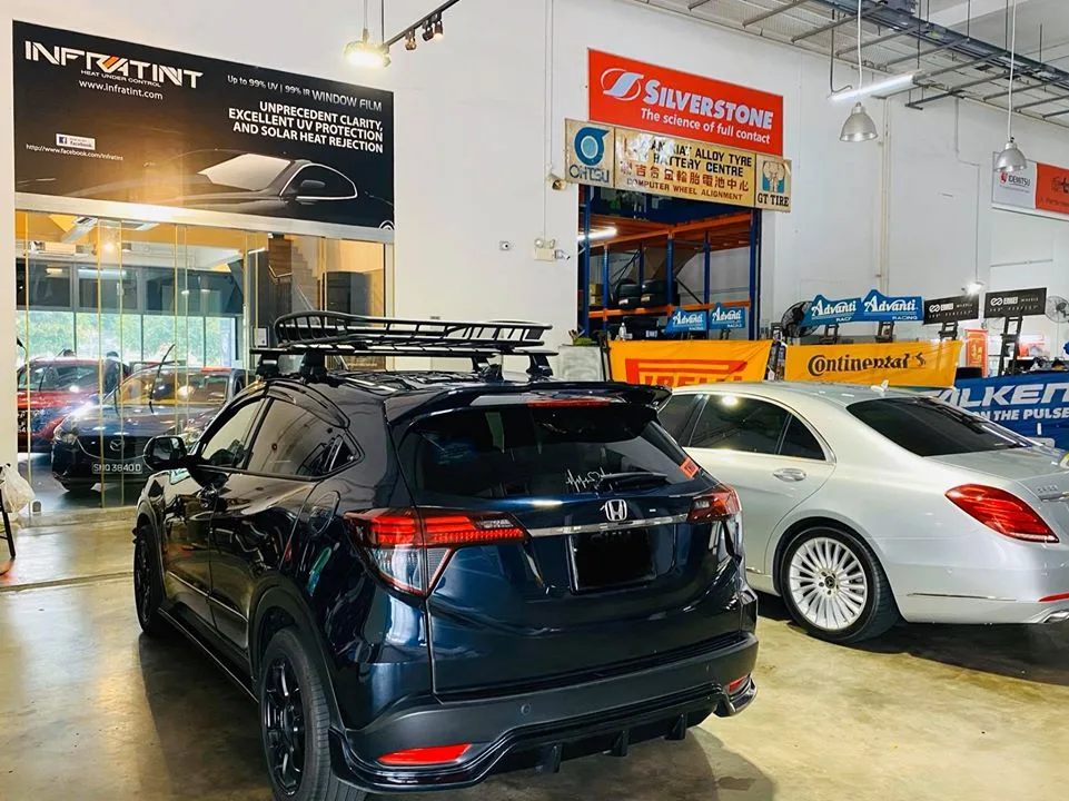 Black Honda HR-V with roof rack and white Mercedes-Benz S-Class at Infratint Singapore
