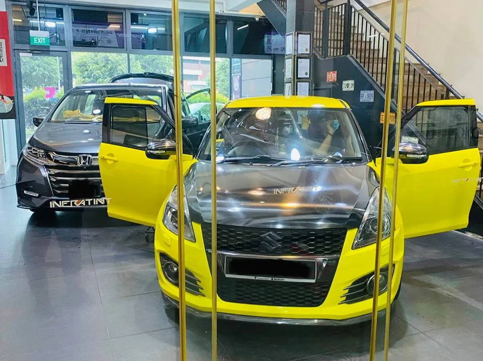 Bright yellow Suzuki Swift and grey Honda Odyssey at Infratint Singapore for tinting