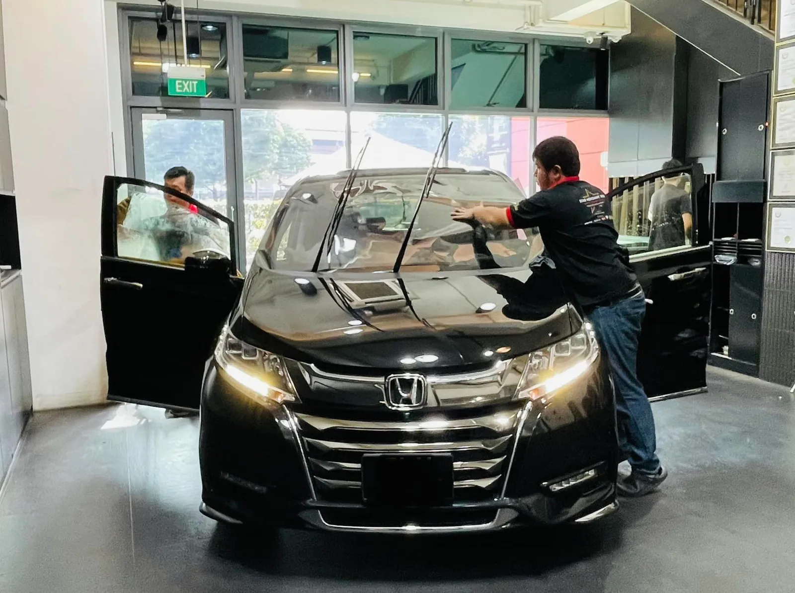 Black Honda Odyssey MPV having its windscreen tinted at Infratint Singapore