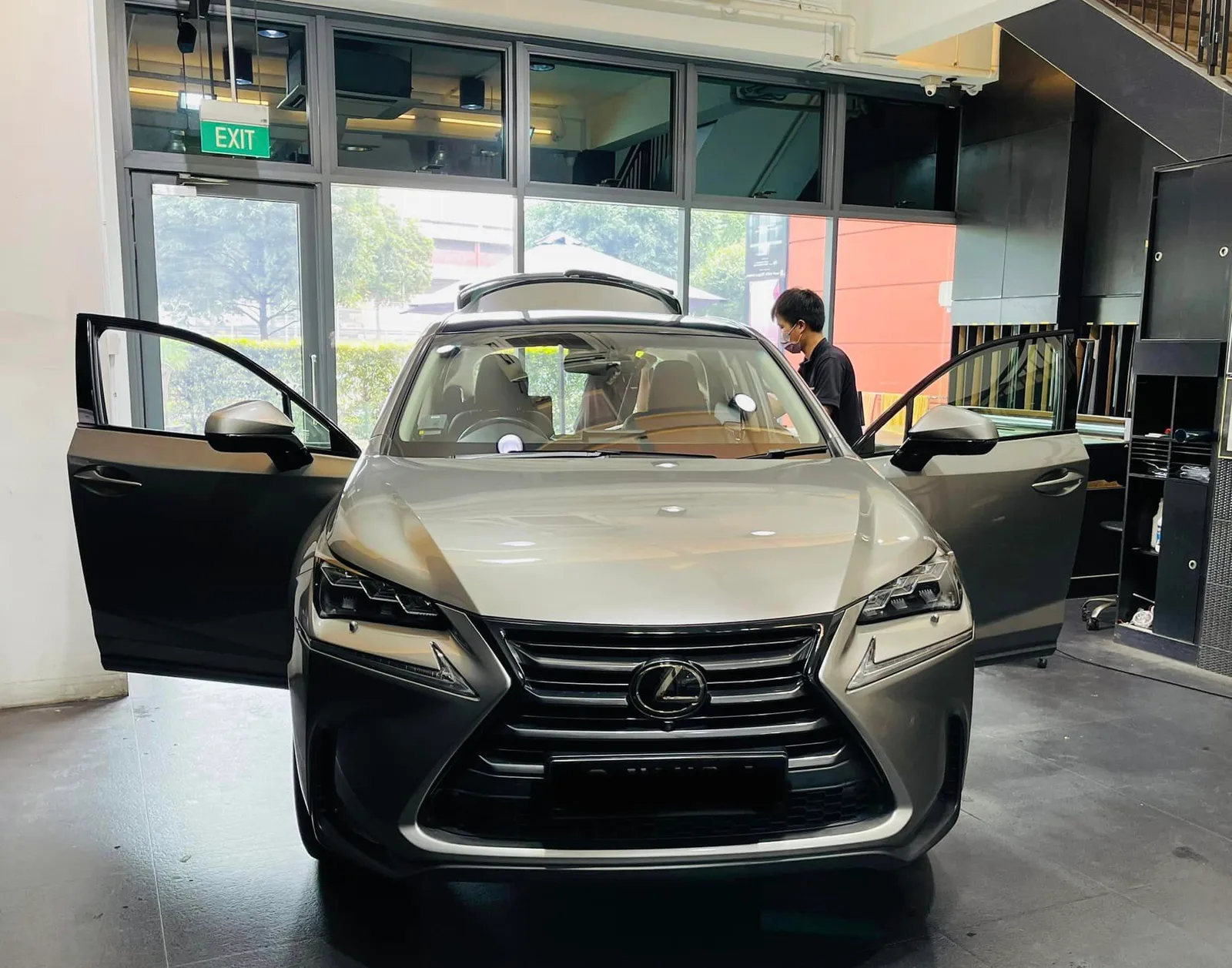 Champagne Lexus NX SUV with doors open at Infratint Singapore for window film