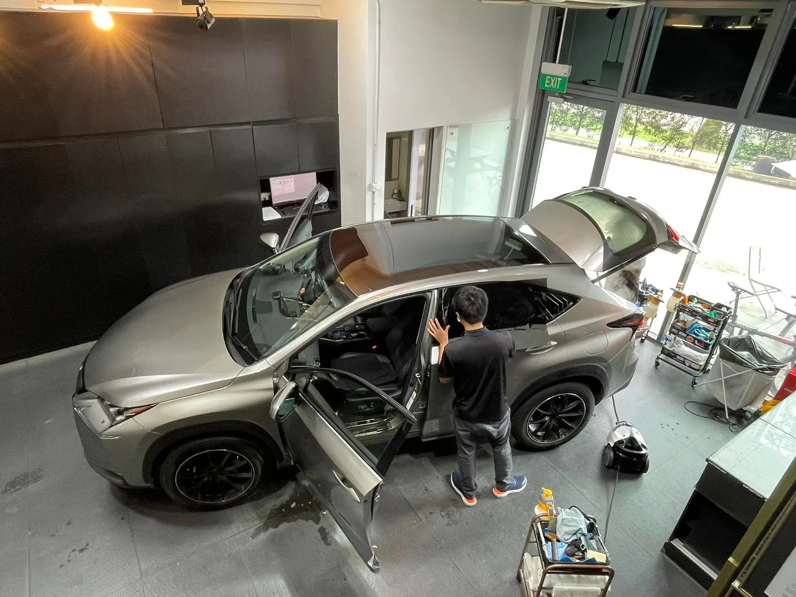 Overhead view of a Lexus NX SUV being window tinted at Infratint Singapore