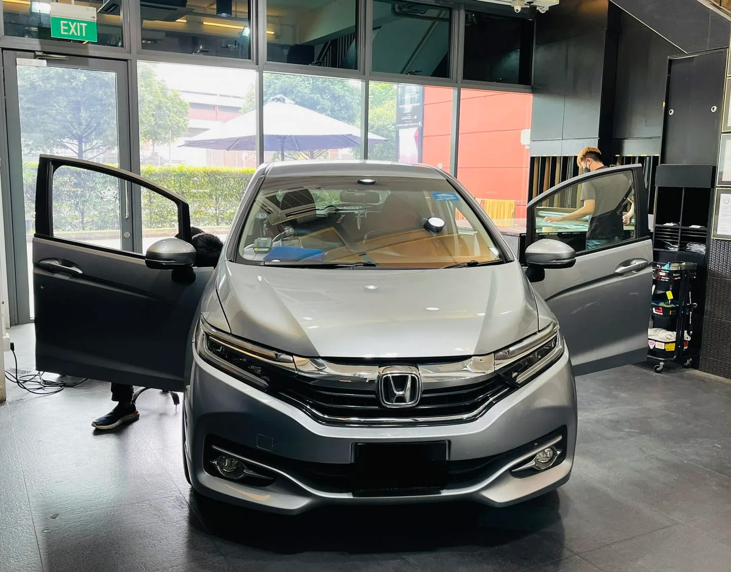 Silver Honda Shuttle with door open at Infratint Singapore showroom for window film