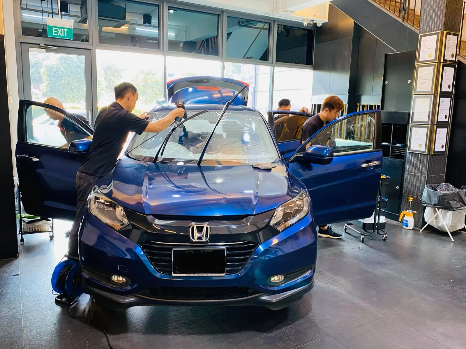 Blue Honda Vezel having its windscreen tinted at Infratint Singapore