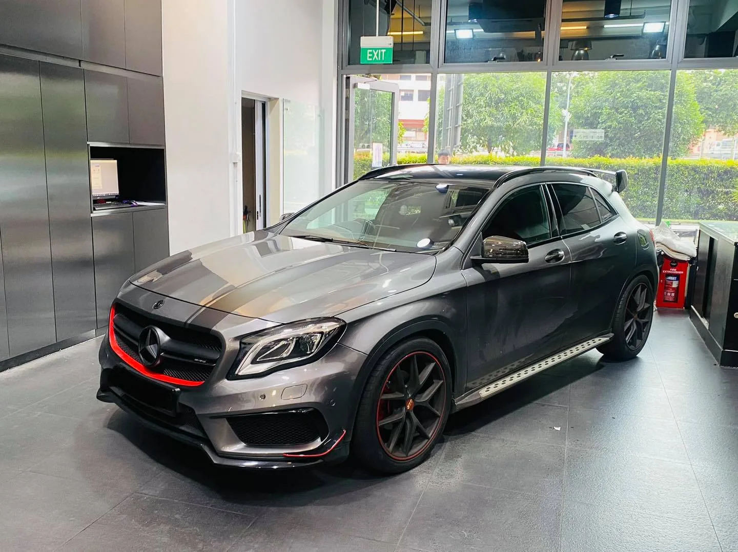Dark grey Mercedes-AMG GLA front three-quarter view at Infratint Singapore