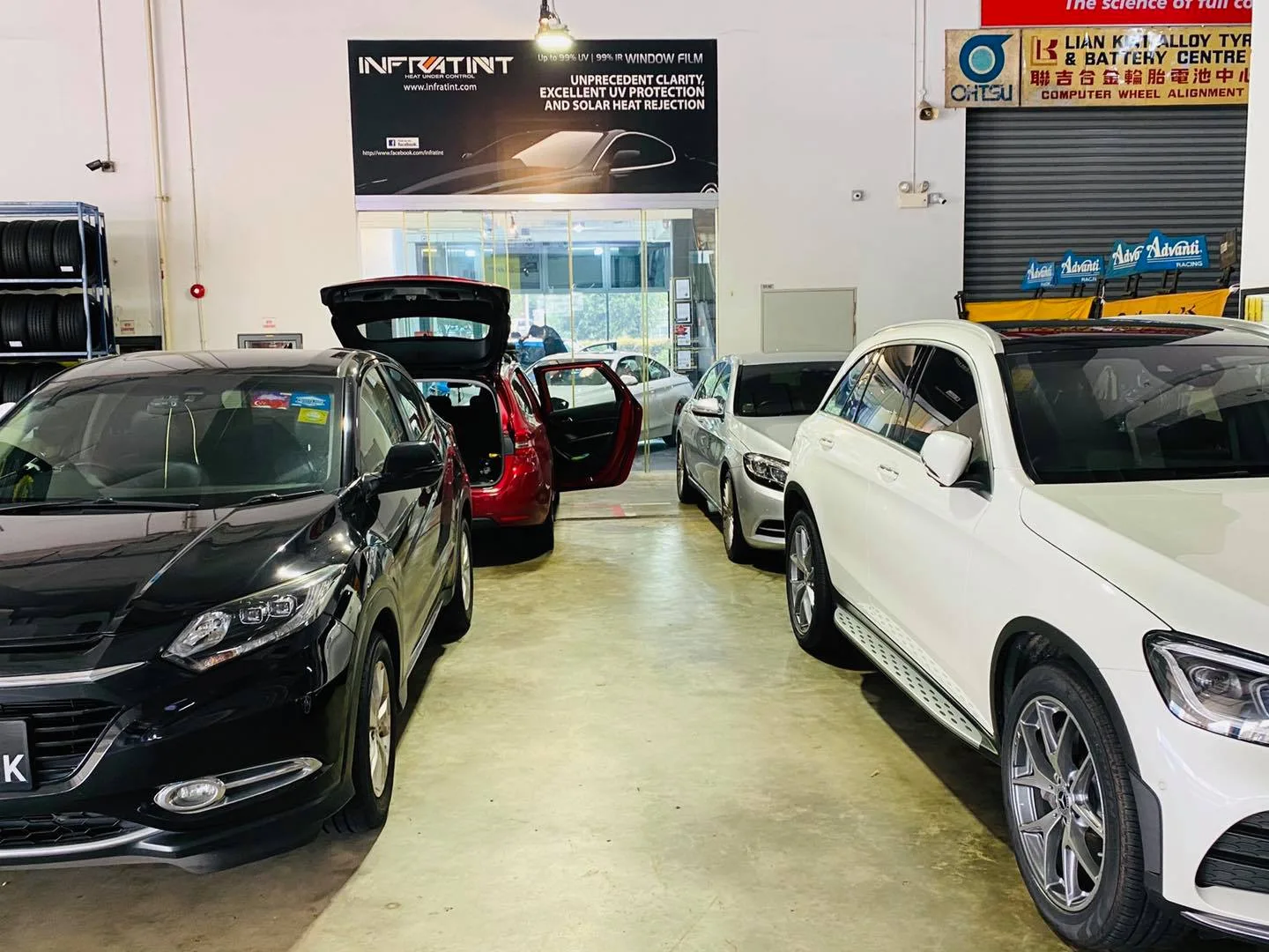 Black Honda Vezel and white Mercedes-Benz GLC at Infratint Singapore