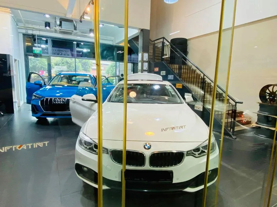 White BMW 4 Series coupe and blue Audi Q3 at Infratint Singapore