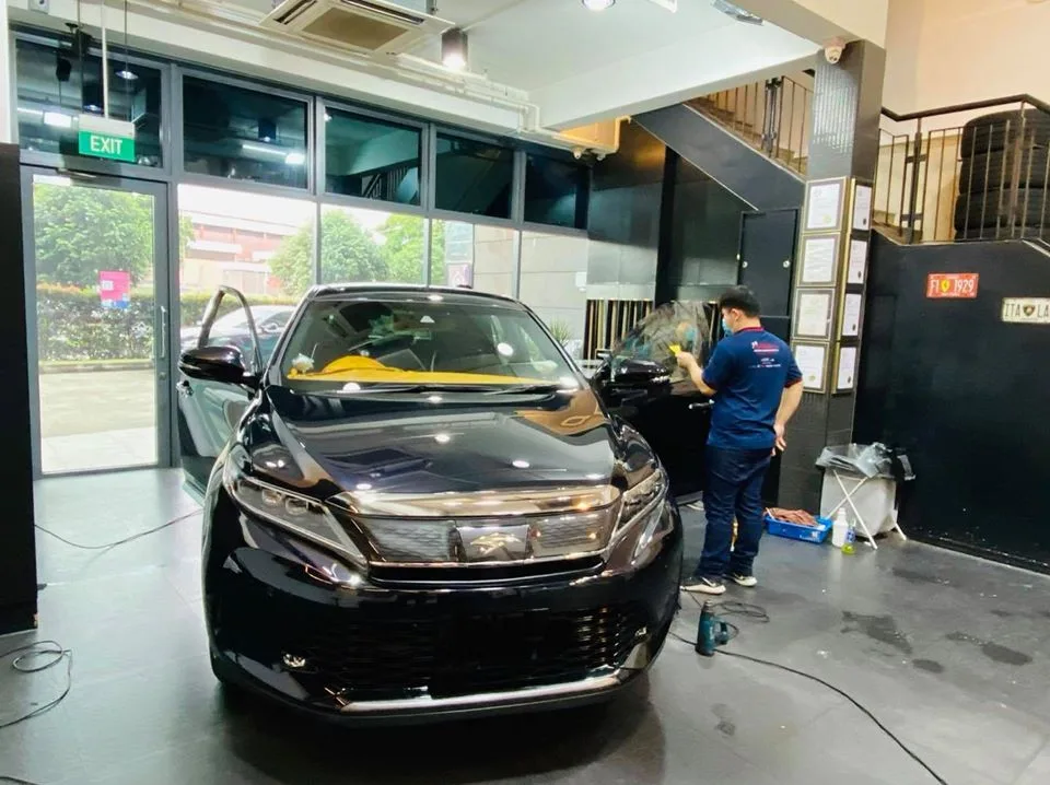 Black Toyota Harrier SUV having its side window tinted at Infratint Singapore