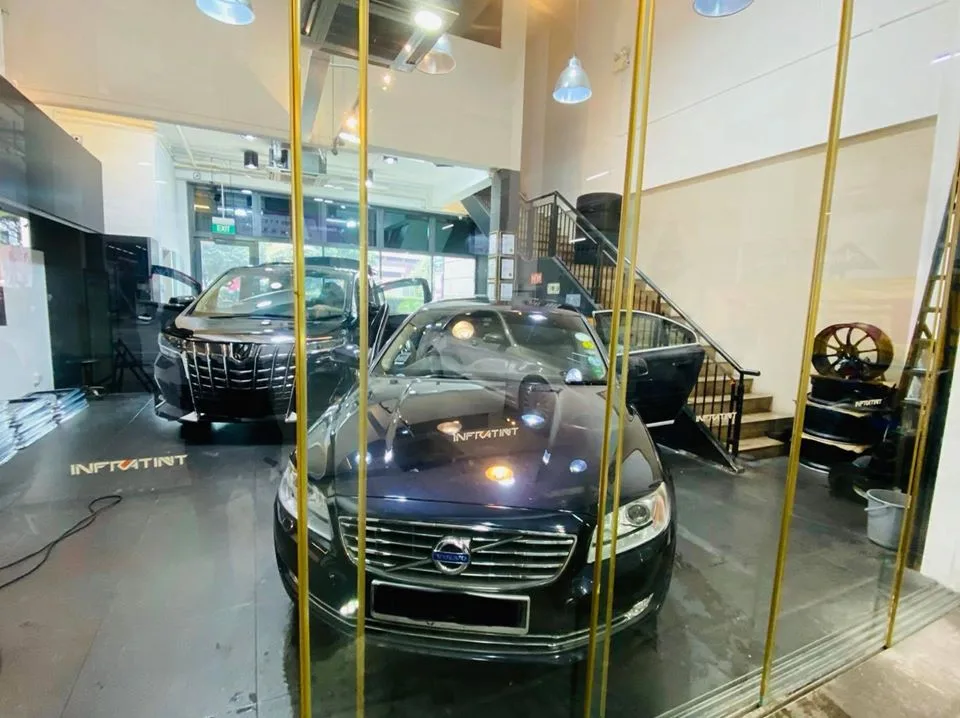 Black Volvo S80 sedan and Toyota Alphard at Infratint Singapore for window tinting