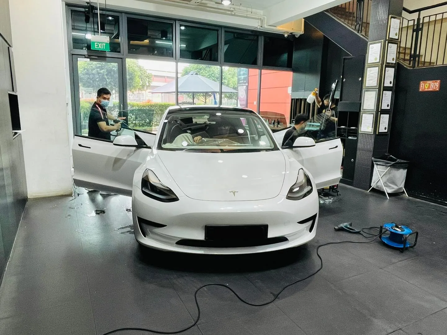 White Tesla Model 3 having its windows tinted at Infratint Singapore