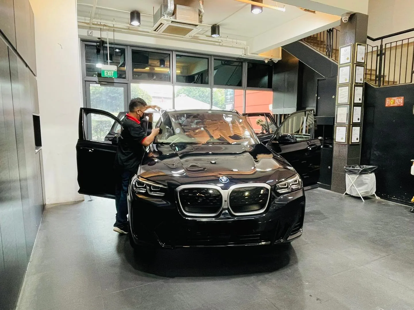 Black BMW SUV front view with door open at Infratint Singapore window tinting