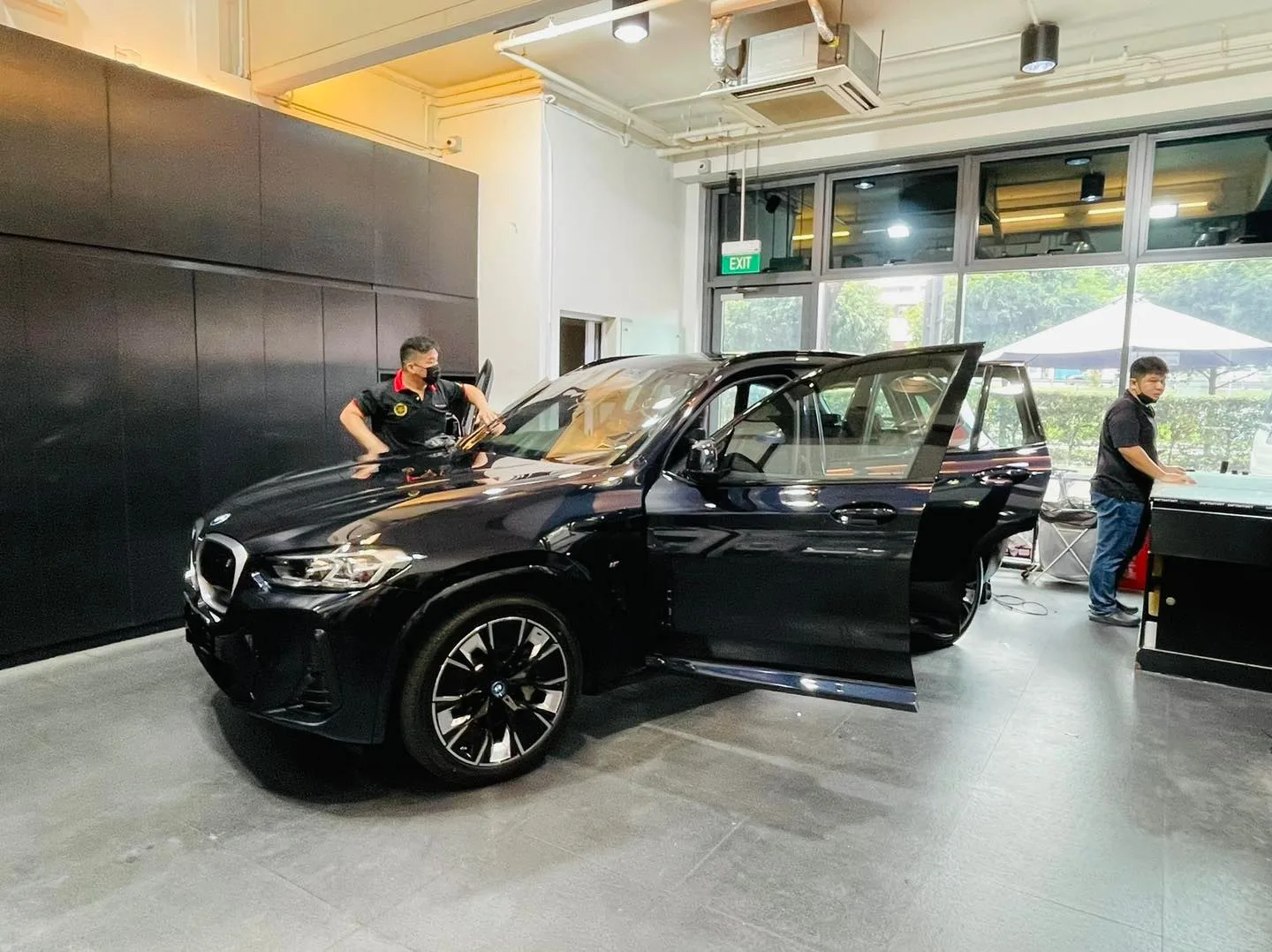 Black BMW SUV side view with doors open at Infratint Singapore