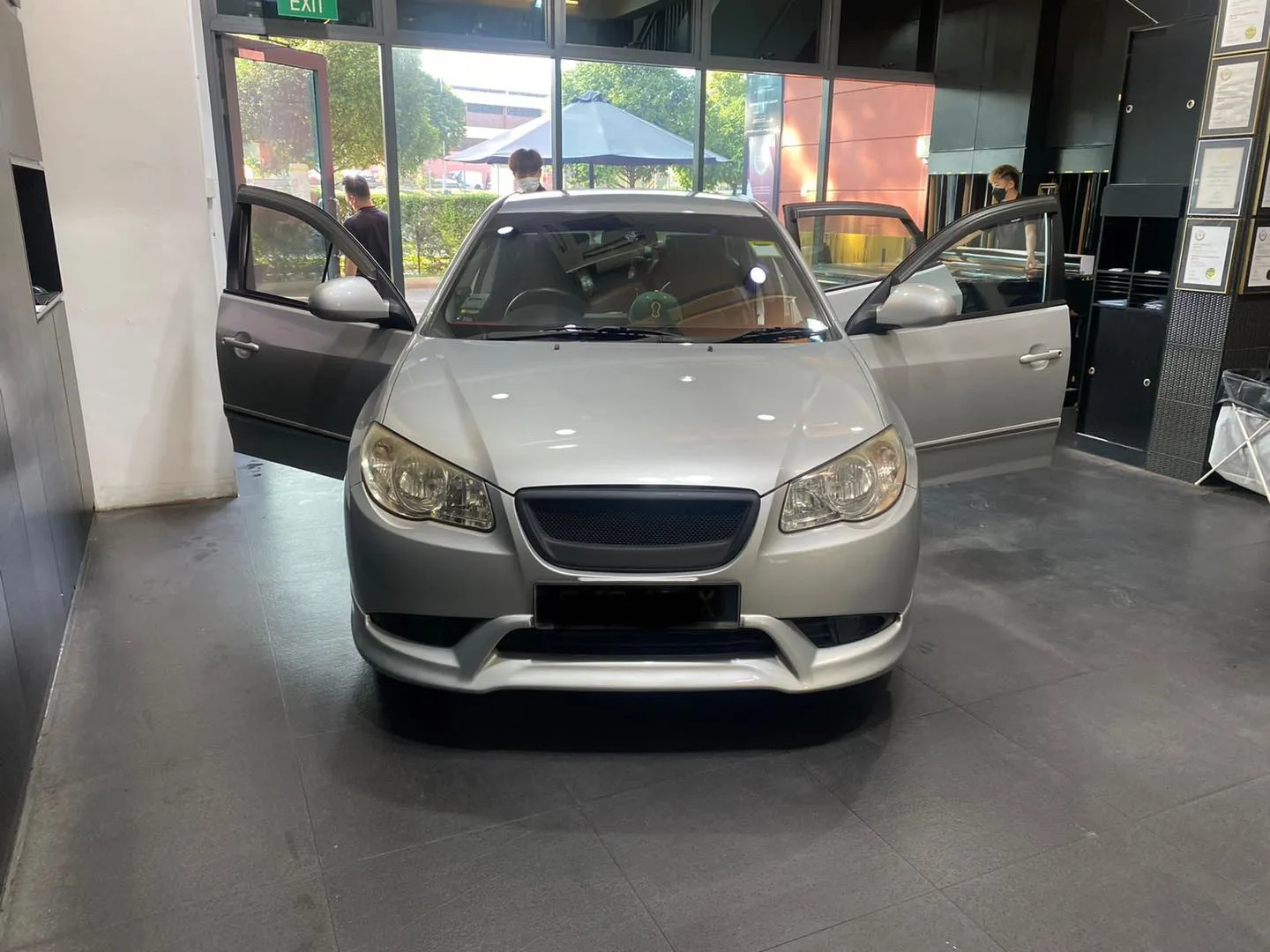 Silver Hyundai Avante with doors open at Infratint Singapore for window tinting