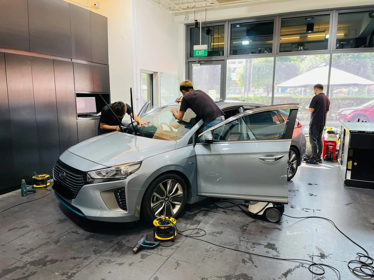 Silver Hyundai Ioniq having window film fitted at Infratint Singapore