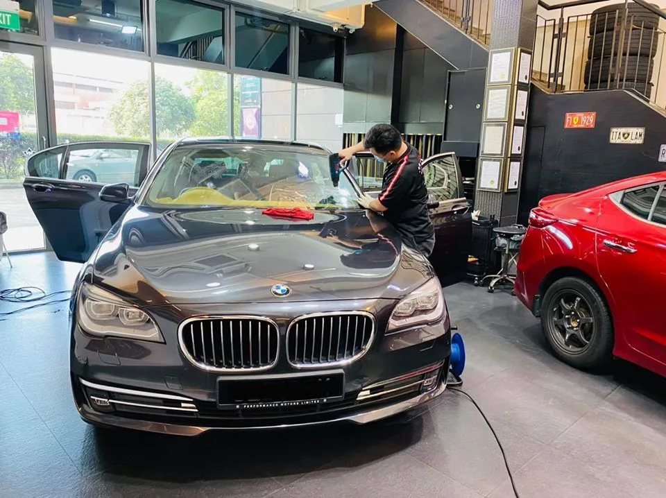 Grey BMW 7 Series having its windscreen filmed at Infratint Singapore