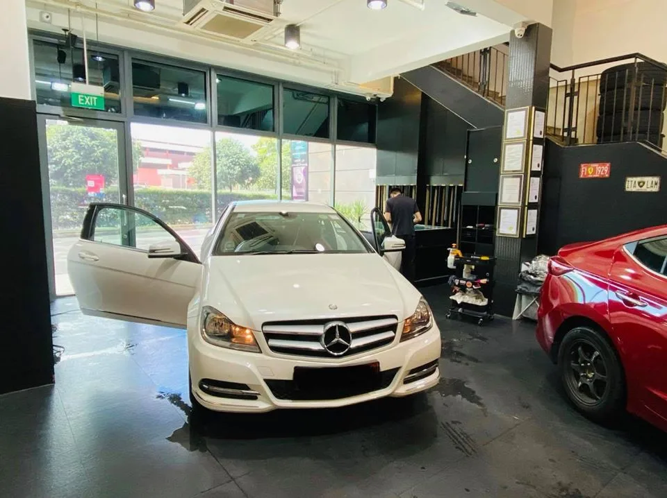 White Mercedes-Benz C-Class sedan and a red coupe at Infratint Singapore